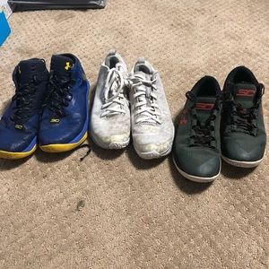 Three pairs of Under Armour basketball shoes